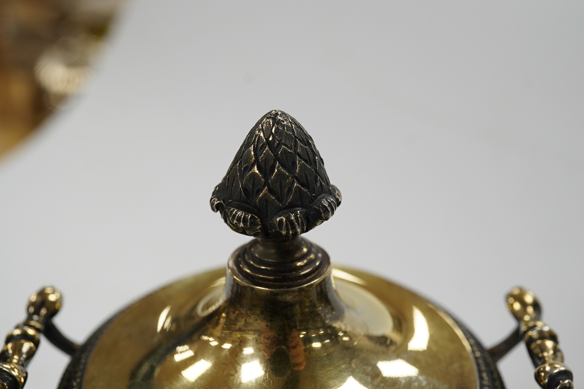 A George V pierced silver gilt two handled sugar vase and cover, by Holland, Aldwinckle & Slater, London, 1912, with clear glass liner, height 17.7cm, 9.7oz. Condition - fair to good